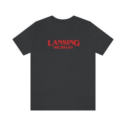 'Lansing Michigan' ' T-Shirt (1980s Drama Parody) | Unisex Standard Fit