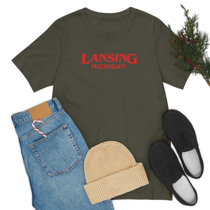 'Lansing Michigan' ' T-Shirt (1980s Drama Parody) | Unisex Standard Fit