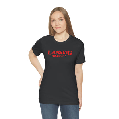 'Lansing Michigan' ' T-Shirt (1980s Drama Parody) | Unisex Standard Fit