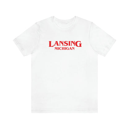 'Lansing Michigan' ' T-Shirt (1980s Drama Parody) | Unisex Standard Fit