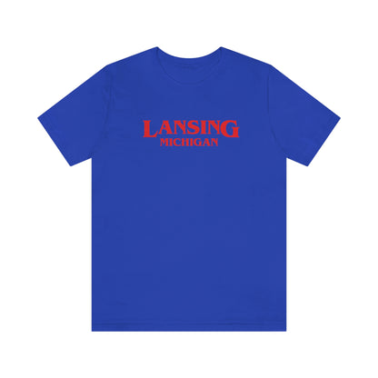 'Lansing Michigan' ' T-Shirt (1980s Drama Parody) | Unisex Standard Fit