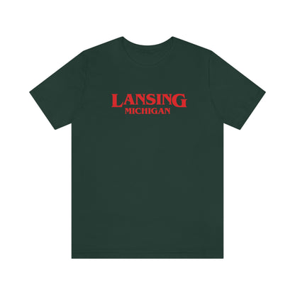 'Lansing Michigan' ' T-Shirt (1980s Drama Parody) | Unisex Standard Fit