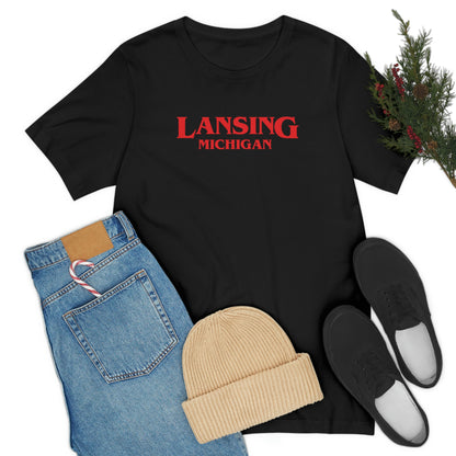 'Lansing Michigan' ' T-Shirt (1980s Drama Parody) | Unisex Standard Fit