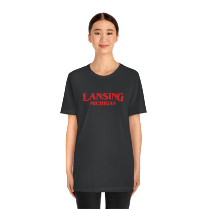 'Lansing Michigan' ' T-Shirt (1980s Drama Parody) | Unisex Standard Fit