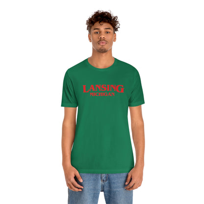 'Lansing Michigan' ' T-Shirt (1980s Drama Parody) | Unisex Standard Fit