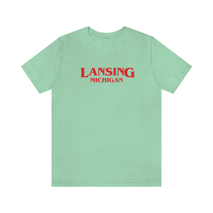 'Lansing Michigan' ' T-Shirt (1980s Drama Parody) | Unisex Standard Fit