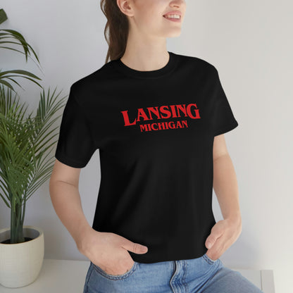 'Lansing Michigan' ' T-Shirt (1980s Drama Parody) | Unisex Standard Fit