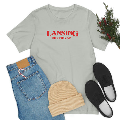 'Lansing Michigan' ' T-Shirt (1980s Drama Parody) | Unisex Standard Fit