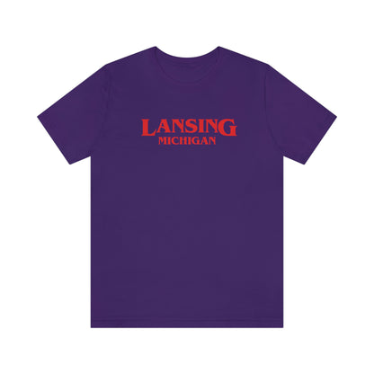 'Lansing Michigan' ' T-Shirt (1980s Drama Parody) | Unisex Standard Fit