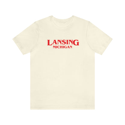 'Lansing Michigan' ' T-Shirt (1980s Drama Parody) | Unisex Standard Fit