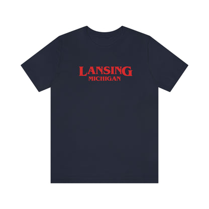 'Lansing Michigan' ' T-Shirt (1980s Drama Parody) | Unisex Standard Fit