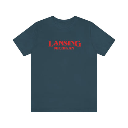 'Lansing Michigan' ' T-Shirt (1980s Drama Parody) | Unisex Standard Fit