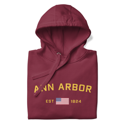 'Ann Arbor EST 1824' Unisex Premium Hoodie (Gold Type w/USA Flag Outline)