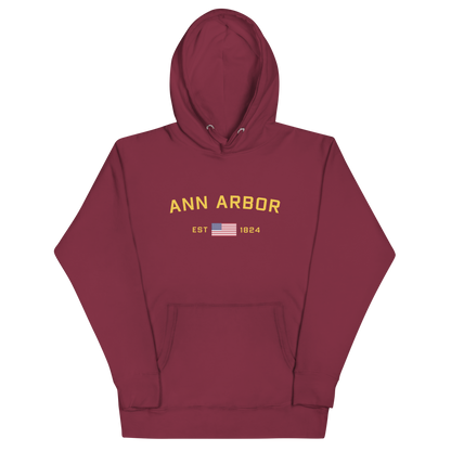 'Ann Arbor EST 1824' Unisex Premium Hoodie (Gold Type w/USA Flag Outline)